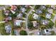 Aerial view of a home with a screened-in pool in a suburban neighborhood at 6583 Waterford Cir, Sarasota, FL 34238