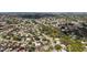 Aerial view of a quiet residential neighborhood, showcasing lush greenery and well-maintained homes at 6583 Waterford Cir, Sarasota, FL 34238