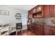 Stylish bar area with custom cabinets and a wine rack, perfect for entertaining guests at 6583 Waterford Cir, Sarasota, FL 34238