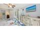 Bright bedroom with a ceiling fan, view of the dresser, and direct access to the closet at 6583 Waterford Cir, Sarasota, FL 34238