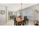 Cozy dining area with a mirrored wall and decorative chandelier at 6583 Waterford Cir, Sarasota, FL 34238
