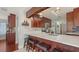 Modern kitchen with stainless steel appliances and a breakfast bar, perfect for casual dining at 6583 Waterford Cir, Sarasota, FL 34238
