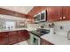 Modern kitchen showcasing stainless steel appliances and sleek countertops, perfect for culinary creations at 6583 Waterford Cir, Sarasota, FL 34238