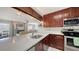 Gourmet kitchen featuring stainless steel appliances and a stylish backsplash, perfect for cooking enthusiasts at 6583 Waterford Cir, Sarasota, FL 34238