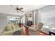 Cozy living room featuring a fireplace and comfortable seating, ideal for relaxing and unwinding at 6583 Waterford Cir, Sarasota, FL 34238