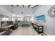 Open living area with plenty of seating, adjacent to dining and kitchen and a view of the pool at 6583 Waterford Cir, Sarasota, FL 34238