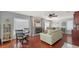 Charming living room with a fireplace and ample natural light, creating a warm and inviting atmosphere at 6583 Waterford Cir, Sarasota, FL 34238