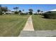Landscaped community featuring a sidewalk and lush green space at 6912 10Th W Ave, Bradenton, FL 34209