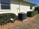 Exterior view of home featuring a modern HVAC system and well-manicured bushes at 6912 10Th W Ave, Bradenton, FL 34209