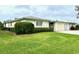 Charming single-story home with a well-manicured lawn and attached garage at 6912 10Th W Ave, Bradenton, FL 34209