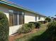 Lovely single-story home featuring well-maintained landscaping and mature greenery at 6912 10Th W Ave, Bradenton, FL 34209