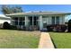 Charming single story home with a well maintained lawn and lush shrubbery at 6912 10Th W Ave, Bradenton, FL 34209
