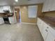 Clean kitchen featuring counter space and an attached dining area with natural light at 6912 10Th W Ave, Bradenton, FL 34209
