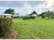 A manicured lawn with landscaping, bushes, and trees sits in the neighborhood at 6912 10Th W Ave, Bradenton, FL 34209