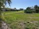 Beautifully landscaped community with lush lawns, mature trees, and a walking path at 6912 10Th W Ave, Bradenton, FL 34209