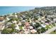 Aerial view of the property in a waterfront community surrounded by mature trees at 7019 10Th S St, St Petersburg, FL 33705