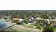 Aerial view of a waterfront community near the bay with luxurious landscaping at 7019 10Th S St, St Petersburg, FL 33705