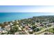 Aerial view of the property in a coastal community with mature trees and beautiful bay views at 7019 10Th S St, St Petersburg, FL 33705
