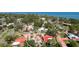 Aerial view of the property surrounded by mature trees in a coastal community at 7019 10Th S St, St Petersburg, FL 33705