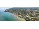 Aerial view of waterfront community with a boat dock and lush landscaping at 7019 10Th S St, St Petersburg, FL 33705