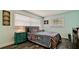 Bright bedroom with modern decor, a large window, and hardwood floors at 7019 10Th S St, St Petersburg, FL 33705