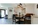 Cozy dining room featuring stylish lighting, a rustic dining table, and comfortable seating at 7019 10Th S St, St Petersburg, FL 33705