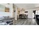 Charming dining area featuring a rustic table, chandelier, and ample natural light at 7019 10Th S St, St Petersburg, FL 33705