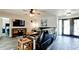 Cozy living room featuring a leather sectional sofa, decorative art and television at 7019 10Th S St, St Petersburg, FL 33705