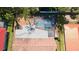 Aerial view of screened pool with lounge chairs and spacious patio in a private backyard at 7019 10Th S St, St Petersburg, FL 33705