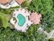 Aerial view of a private pool with a large patio and tropical landscaping at 7270 Alicante Dr # 3, Sarasota, FL 34238