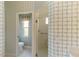 Bathroom featuring a glass-enclosed shower and separate toilet room for added privacy at 7270 Alicante Dr # 3, Sarasota, FL 34238
