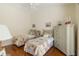 Bright twin bedroom featuring hardwood floors and neutral decor, perfect for a cozy and restful space at 7270 Alicante Dr # 3, Sarasota, FL 34238