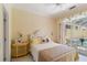 Bright bedroom with access to the pool area, creating an indoor-outdoor living experience at 7270 Alicante Dr # 3, Sarasota, FL 34238