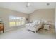 Bright bedroom with a vaulted ceiling, neutral carpet, and a view of the outside at 7270 Alicante Dr # 3, Sarasota, FL 34238