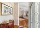 Elegant foyer featuring hardwood floors, an ornate dresser, and an inviting view into the bright and open living space at 7270 Alicante Dr # 3, Sarasota, FL 34238