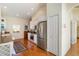 Well-lit kitchen with stainless steel appliances, white cabinets, and hardwood flooring at 7270 Alicante Dr # 3, Sarasota, FL 34238