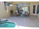 This outdoor patio features a plunge pool, table, four chairs and flower arrangement at 7270 Alicante Dr # 3, Sarasota, FL 34238