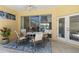 Charming outdoor patio with seating area, ceiling fan, and natural light, perfect for relaxation and entertaining guests at 7270 Alicante Dr # 3, Sarasota, FL 34238