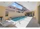 Beautiful screened-in pool with tile accents, surrounded by ample seating and sunlight, creating a perfect outdoor oasis at 7270 Alicante Dr # 3, Sarasota, FL 34238