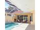 Enclosed pool area with seating under a screened roof, perfect for outdoor dining and relaxation at 7270 Alicante Dr # 3, Sarasota, FL 34238