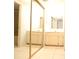 Bathroom with double sinks, mirrored closet, and tile flooring at 7500 40Th W Ave # 209, Bradenton, FL 34209
