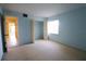 Bright bedroom with carpet, closet, and natural light through a window at 7500 40Th W Ave # 209, Bradenton, FL 34209
