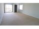 A bright bedroom with sliding glass doors leading to a screened balcony at 7500 40Th W Ave # 209, Bradenton, FL 34209