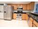 A well-equipped kitchen featuring stainless steel appliances and tile flooring at 7500 40Th W Ave # 209, Bradenton, FL 34209