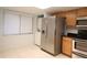 This kitchen features stainless steel appliances, including a refrigerator, oven, and microwave at 7500 40Th W Ave # 209, Bradenton, FL 34209
