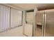 Laundry area featuring stainless steel refrigerator and stacked washer and dryer at 7500 40Th W Ave # 209, Bradenton, FL 34209