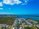 Picturesque aerial view of coastal real estate featuring homes along canals and a view of ocean at 8152 Seashell St, Englewood, FL 34224