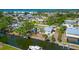 Picturesque aerial view showcasing waterfront houses with boat docks along winding canals at 8152 Seashell St, Englewood, FL 34224