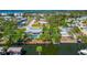 Scenic aerial view of waterfront homes with boat docks and lush surroundings at 8152 Seashell St, Englewood, FL 34224