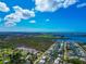 Panoramic aerial view of a waterfront community featuring lush greenery and residential neighborhoods at 8152 Seashell St, Englewood, FL 34224